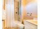 Well-maintained bathroom featuring a tub/shower combo with tile surround, toilet, and vanity at 831 Mandalay Ave, Clearwater, FL 33767