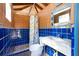 Unique bathroom with colorful tile, a shower, and wood ceiling at 831 Mandalay Ave, Clearwater, FL 33767