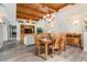 Dining room features wood ceiling, an elegant chandelier and natural light, and is open to the living room at 831 Mandalay Ave, Clearwater, FL 33767