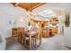 Bright dining room features wood ceiling and floors, an elegant chandelier, and lots of natural light at 831 Mandalay Ave, Clearwater, FL 33767