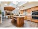 Open-concept kitchen with an island, dining area, and views into the living room at 831 Mandalay Ave, Clearwater, FL 33767