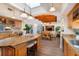 Open-concept kitchen with an island, dining area, and views into the living room at 831 Mandalay Ave, Clearwater, FL 33767