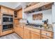 Gourmet kitchen featuring granite counters and stainless steel appliances at 831 Mandalay Ave, Clearwater, FL 33767