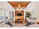 Living room with built-in entertainment center, wood ceiling, hardwood floors and lots of natural light at 831 Mandalay Ave, Clearwater, FL 33767