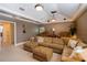 Comfortable entertainment room featuring a sectional sofa, tiered seating, and decorative ceiling at 831 Mandalay Ave, Clearwater, FL 33767