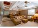 Entertainment room with tiered seating, comfortable couch, and ornate ceiling with recessed lighting at 831 Mandalay Ave, Clearwater, FL 33767