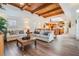 Spacious living room and dining area with wood ceiling, hardwood floors and an open concept layout at 831 Mandalay Ave, Clearwater, FL 33767