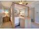 Well-lit bedroom with a four-poster bed, neutral decor, and built-in TV console at 831 Mandalay Ave, Clearwater, FL 33767