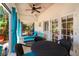 Covered patio with outdoor table and chairs and lounge furniture with outdoor views at 831 Mandalay Ave, Clearwater, FL 33767
