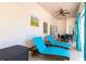 Inviting covered patio with comfortable lounge chairs and outdoor dining set at 831 Mandalay Ave, Clearwater, FL 33767