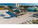 Beachfront restaurant with covered outdoor seating and palm tree lined entrance at 831 Mandalay Ave, Clearwater, FL 33767