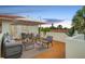 Inviting rooftop patio with comfortable seating, umbrella, bar seating and sunset views at 831 Mandalay Ave, Clearwater, FL 33767