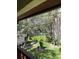 Balcony view of a lush, landscaped pathway between buildings at 8636 Tahoe Ct # 13, Tampa, FL 33614