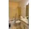 Small bathroom featuring a tub and shower combo, yellow tile surround, and a single sink vanity at 8636 Tahoe Ct # 13, Tampa, FL 33614