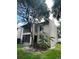 Exterior apartment view showcasing a balcony and screened-in patio at 8636 Tahoe Ct # 13, Tampa, FL 33614