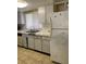 Kitchen with standard appliances and white cabinets at 8636 Tahoe Ct # 13, Tampa, FL 33614