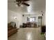 Living room area with tile floors and view into kitchen at 8636 Tahoe Ct # 13, Tampa, FL 33614