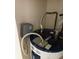 Close-up of Whirlpool water heater and plumbing with braided steel water lines at 8636 Tahoe Ct # 13, Tampa, FL 33614
