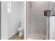 This bathroom boasts a glass shower, tiled walls, and modern fixtures for a clean look at 9429 Northcliffe Blvd, Spring Hill, FL 34606
