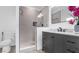 Modern bathroom features a glass-enclosed shower, sleek vanity, and stylish fixtures at 9429 Northcliffe Blvd, Spring Hill, FL 34606