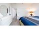Bright bedroom with a bed, dresser, and closet at 9429 Northcliffe Blvd, Spring Hill, FL 34606