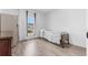 Bright bedroom with large window, light-colored walls, and minimal furniture at 9429 Northcliffe Blvd, Spring Hill, FL 34606