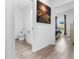 Hallway view of bathroom featuring a toilet and bedroom with view of backyard at 9429 Northcliffe Blvd, Spring Hill, FL 34606