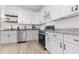 Stylish kitchen featuring stainless steel appliances, granite countertops, and ample cabinet space at 9429 Northcliffe Blvd, Spring Hill, FL 34606