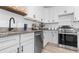 Modern kitchen featuring granite countertops, stainless steel appliances, and ample cabinet space at 9429 Northcliffe Blvd, Spring Hill, FL 34606