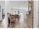 Bright open-plan living room with hardwood floors and sliding doors to the backyard at 9429 Northcliffe Blvd, Spring Hill, FL 34606