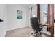 Bright office with a dark desk and office chair next to a window at 9429 Northcliffe Blvd, Spring Hill, FL 34606