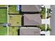 Aerial view of a residential neighborhood showcasing well-maintained homes, green spaces, and backyard amenities at 9440 Lemon Drop Loop, Sun City Center, FL 33573