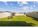 A large, well-maintained backyard featuring a shed, swing set, and outdoor seating, perfect for Gathering activities at 9440 Lemon Drop Loop, Sun City Center, FL 33573
