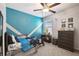 room with celestial accent wall, toys, and dark wood furniture at 9440 Lemon Drop Loop, Sun City Center, FL 33573