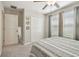 Bright bedroom with carpet floors, ceiling fan, closet, and window at 9440 Lemon Drop Loop, Sun City Center, FL 33573