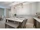 Bright dining room features stylish lighting, a marble table with seating for six, and tile flooring at 9440 Lemon Drop Loop, Sun City Center, FL 33573