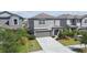 Charming two-story home with a well-manicured lawn, mature trees, and a spacious driveway at 9440 Lemon Drop Loop, Sun City Center, FL 33573