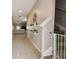 Bright hallway with tiled floors, leading to the living area and stairs to the second level at 9440 Lemon Drop Loop, Sun City Center, FL 33573