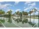 Outdoor basketball court features palm trees and is a great place for exercise and fun at 9514 Channing Hill Dr, Sun City Center, FL 33573