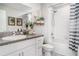 Bathroom features vanity with granite counters and a shower/tub combo at 9514 Channing Hill Dr, Sun City Center, FL 33573