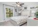 Bright bedroom with large window and a neatly decorated bed at 9514 Channing Hill Dr, Sun City Center, FL 33573