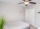 Cozy bedroom features a simple bed and a closet at 9514 Channing Hill Dr, Sun City Center, FL 33573