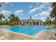 Luxurious community pool featuring a gazebo and plenty of lounge chairs at 9514 Channing Hill Dr, Sun City Center, FL 33573