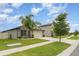 Charming single-Gathering home with lush lawn and landscaping, as well as a two-car garage at 9514 Channing Hill Dr, Sun City Center, FL 33573