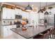 Modern kitchen featuring stainless steel appliances, granite countertops, and ample cabinet space at 9514 Channing Hill Dr, Sun City Center, FL 33573