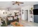 Open-concept living room featuring stylish decor, comfortable seating, and a seamless flow to the kitchen at 9514 Channing Hill Dr, Sun City Center, FL 33573