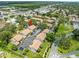 Drone shot displays residential buildings with parking and lush green landscaping at 9804 Lombard Ct # 104, Tampa, FL 33618