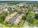 Drone shot displays residential buildings with parking and lush green landscaping at 9804 Lombard Ct # 104, Tampa, FL 33618