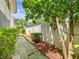 Landscaped backyard with stone paver pathway and privacy fence at 9804 Lombard Ct # 104, Tampa, FL 33618