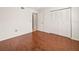 Bedroom with sleek wood flooring and large closets, with ample light and easy access at 9804 Lombard Ct # 104, Tampa, FL 33618